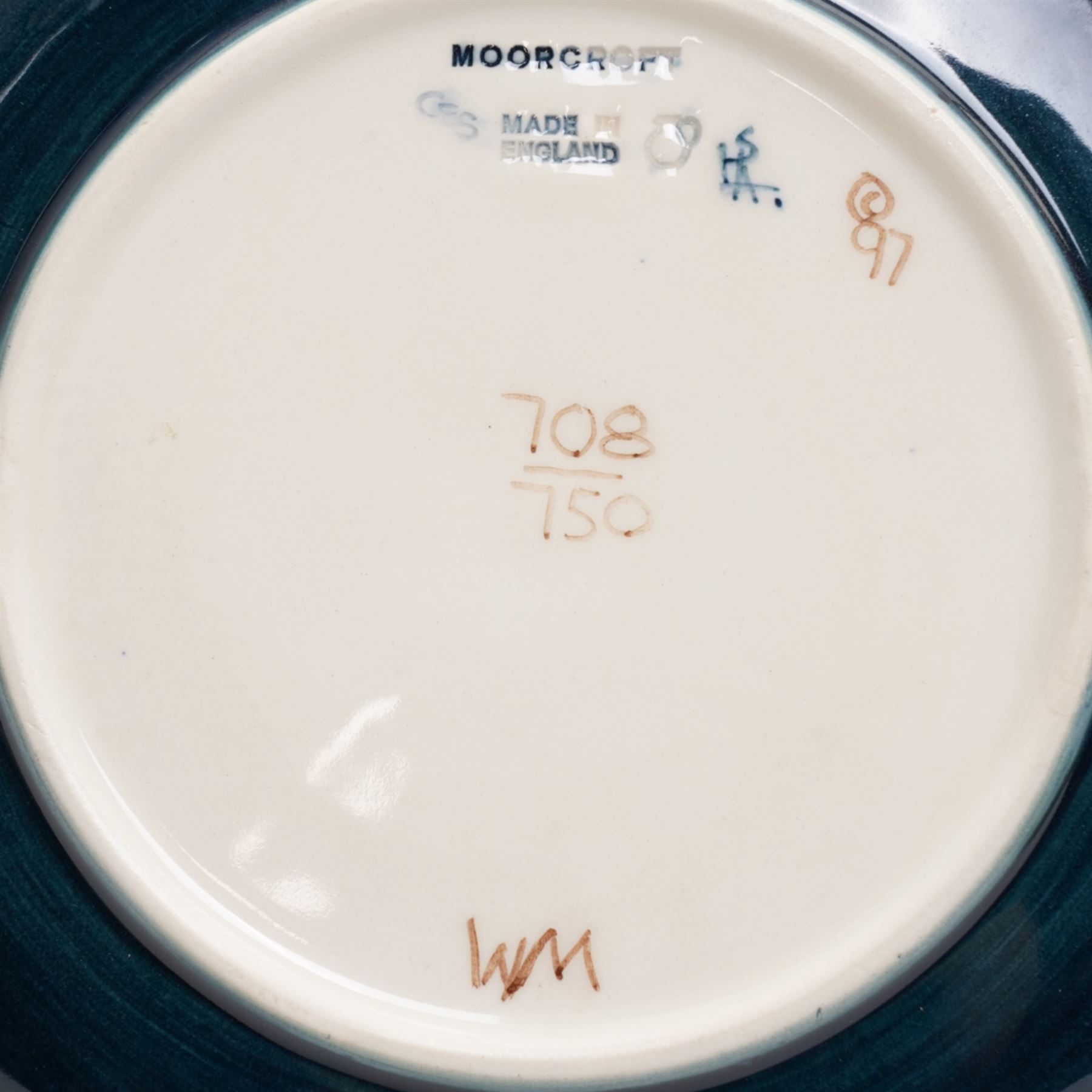 Moorcroft limited edition Birth of Light pattern millennium year plate, numbered 699/2000, impressed and painted marks to base; together with three other year plates comprising 1998, 1992 and Spitalfields Temple Mills edition 1991 plate (4)