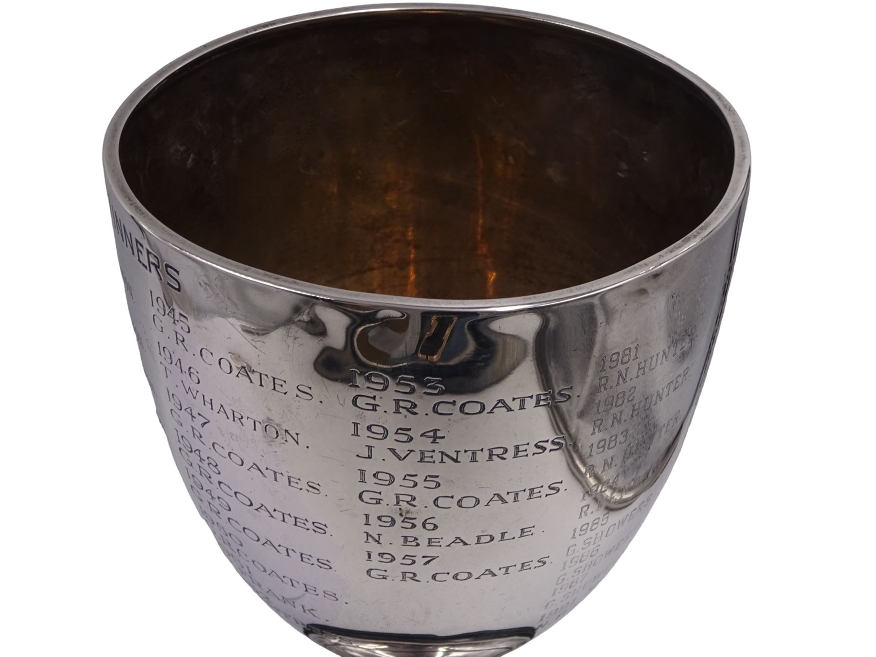 1930s silver trophy cup, of plain form, upon knopped stem and circular stepped foot, body with presentation engraving 'Cloughton and Burniston Sweet Pea Challenge Cup' with winners engraved verso, hallmarked Walker & Hall, Sheffield 1931, upon ebonised base, including base H28.7cm