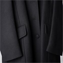 Prada - black Melton wool coat, in a redingote style with front fastening and fabric-covered buttons, flap pockets and a structured collar with slit to the back, size 44, unused with the original garment bag and hanger