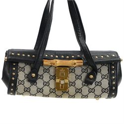 Gucci 'Bamboo Bullet' shoulder handbag, the canvas body with repetitive GG logo design and black studded leather border, with gold tone clasp impressed Gucci, and bamboo handle, with interior zip pocket, serial no. 910998 9019 impressed to interior leather, with Gucci satin dust bag, H14cm, W20cm