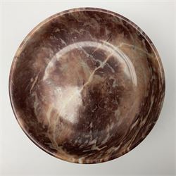 Pink veined marble bowl, of circular form, upon a spreading circular foot H12cm D22