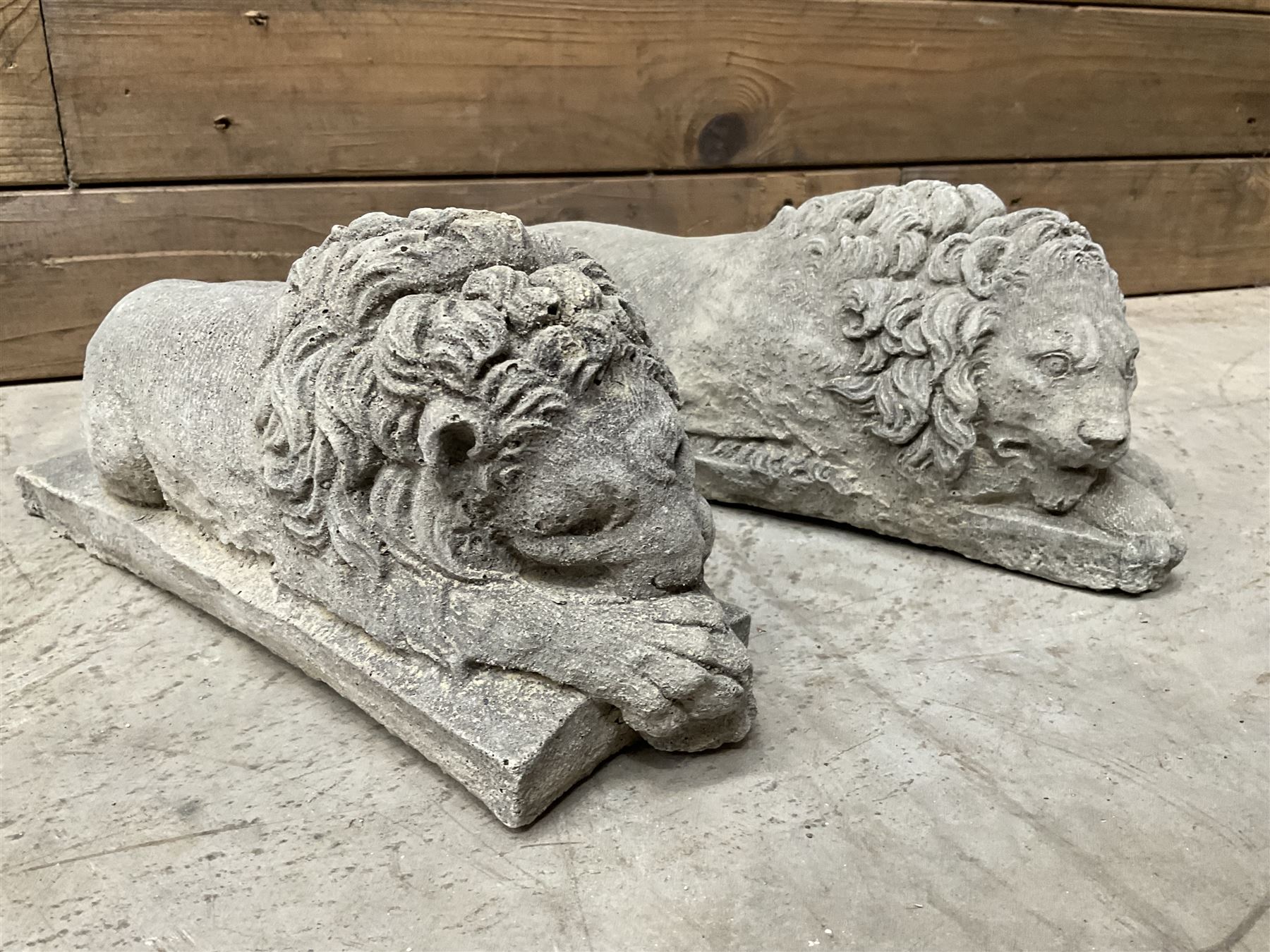 Pair of small cast stone sleeping Trafalgar Lions