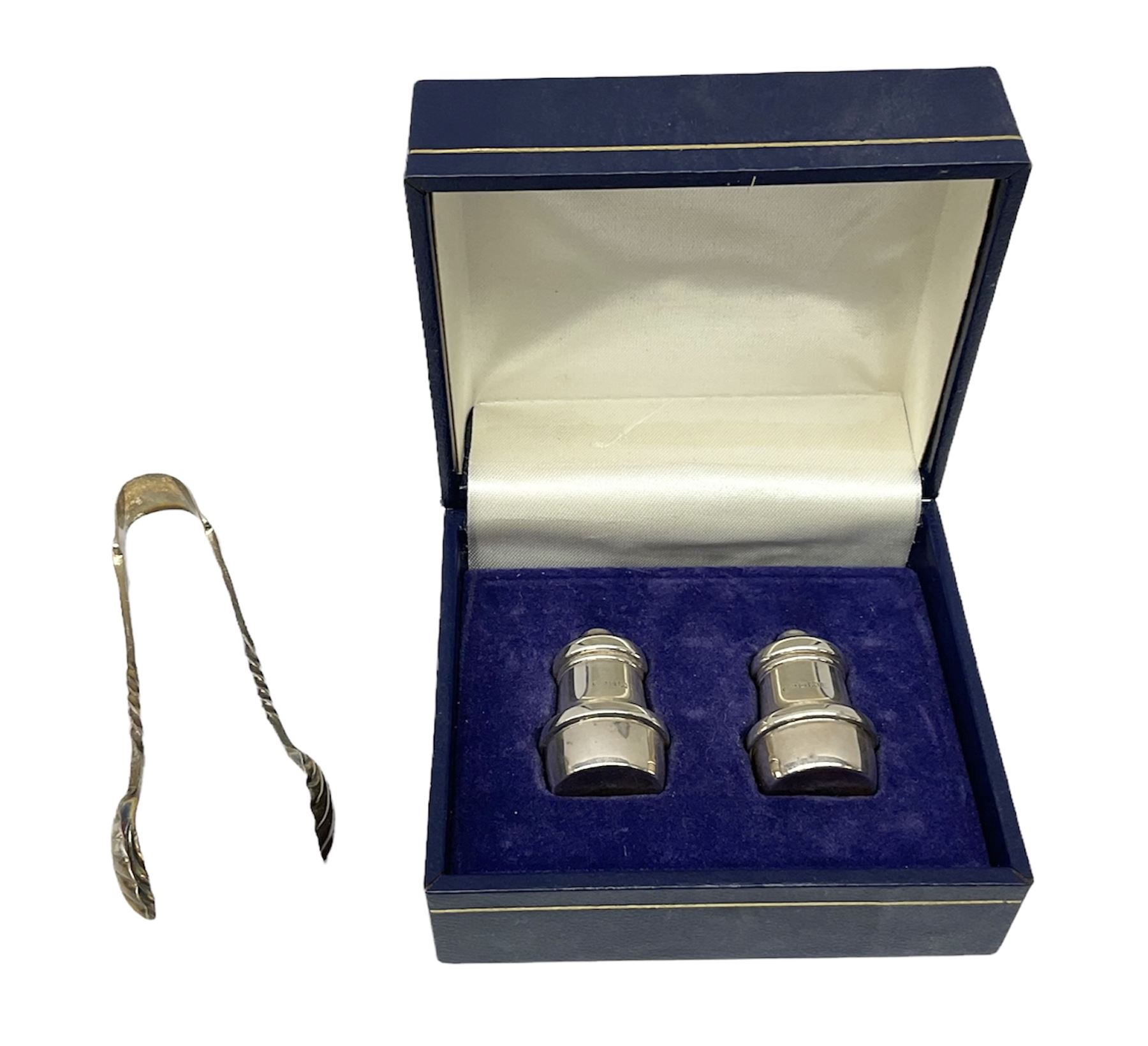Pair of miniature hallmarked silver cruets, in fitted box, together with a pair of hallmarked silver sugar tongs, approximate total silver weight 38 grams
