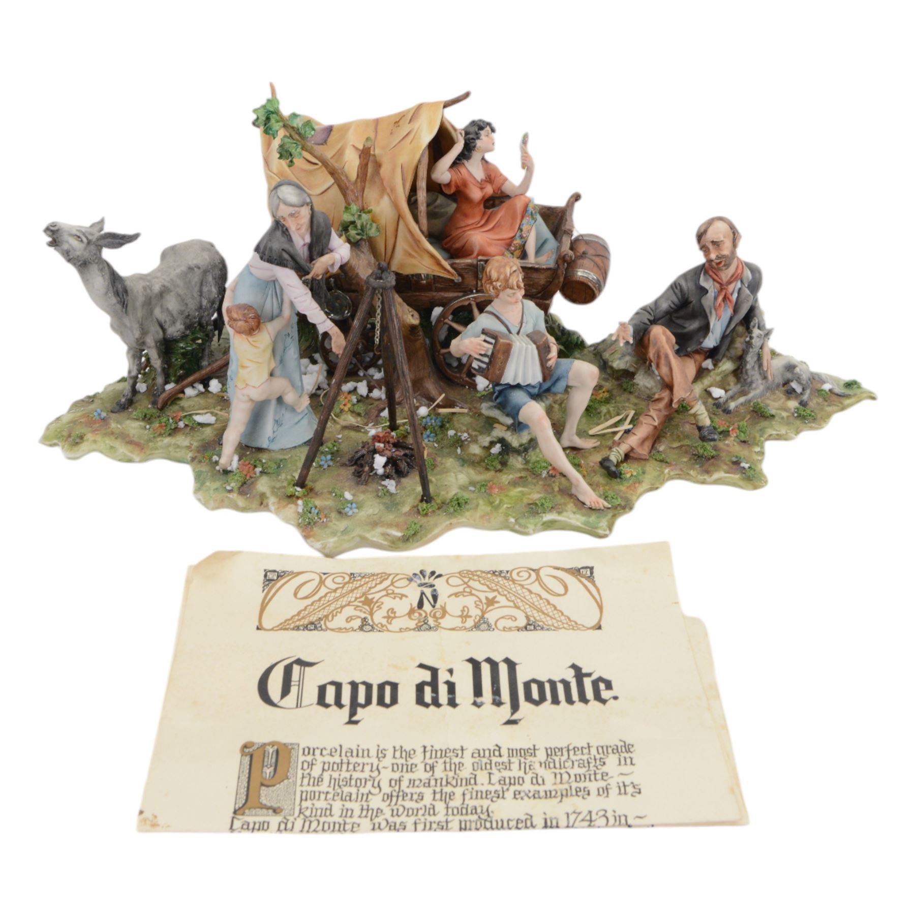 Capodimonte figural group of a gypsy encampment including wagon, cooking fire and people, H21cm