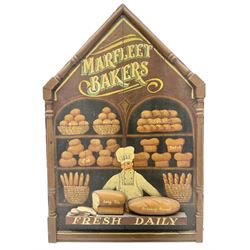 Painted wood panelled sign of a chef in his bakery moulded with loaves of bread titled Marfleet Bakers in cream and green lettering, detailed Fresh Daily, in raised brown frame, L92cm
