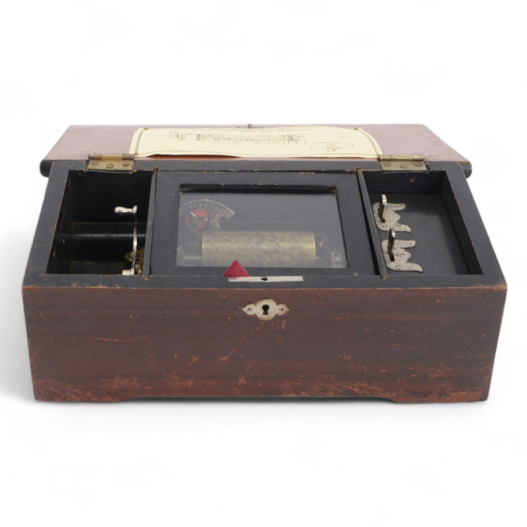 Early 20th century Swiss musical box- in a plain mahogany finished case playing six airs on a 30 tooth steel comb, with a 3-1/4”  pinned cylinder and tune indicator, with play/stop/repeat/change/ levers, crank wound spring driven barrel with Geneva stopwork, case fitted with an internal viewing glass.