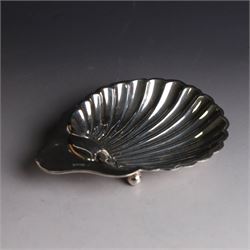 Edwardian silver clam shell butter dish, upon three bun feet, hallmarked James Deakin & Sons, Sheffield 1910