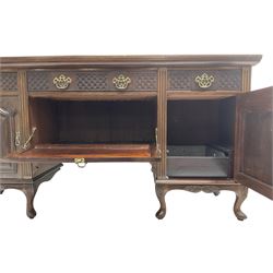 Late Victorian walnut sideboard, moulded rectangular top over three drawers  with blind fretwork facias, fitted with central fall front cupboard with extending foliage carved decoration and two flanking panelled cupboards, on acanthus carved cabriole feet