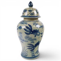 Pair of Chinese blue and white jars and covers, of baluster form, painted with fish and foliage H36cm