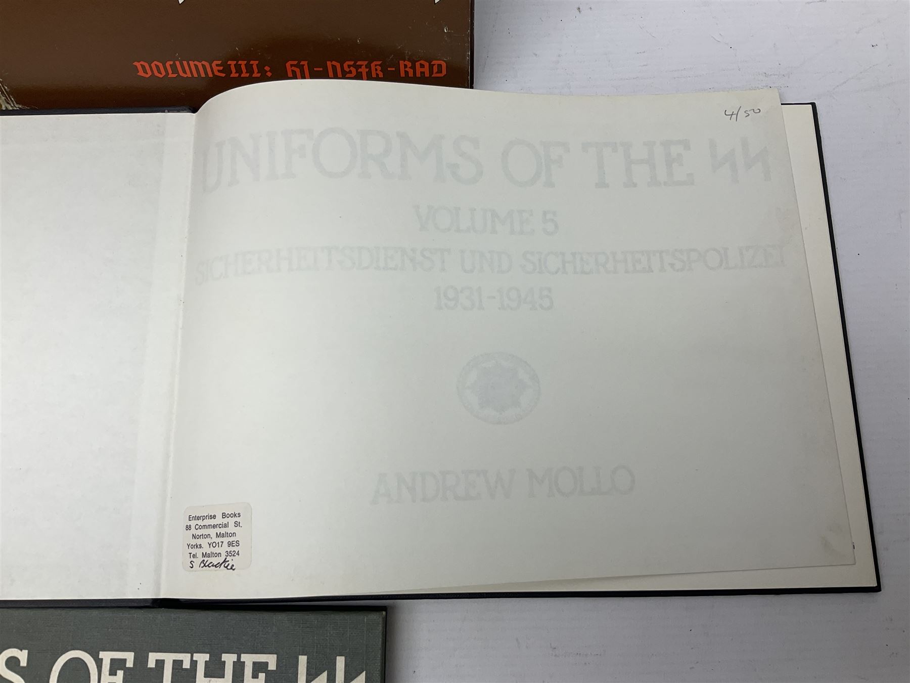 Military Collectors Service: set of three books on WWII German uniforms and badges; and Mollo Andrew: Uniforms of the SS. Volumes 1,4,5,6 & 7 (8)