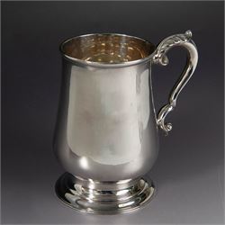 1920s silver tankard, of plain cylindrical form with acanthus capped C scroll handle and u...