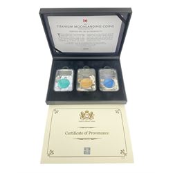 Queen Elizabeth II Bailiwick of Guernsey 2019 'The Titanium Moonlanding' fifty pence three coin set, comprising 'Green', 'Orange' and 'Blue' titanium coins, in capsules and case with certificate