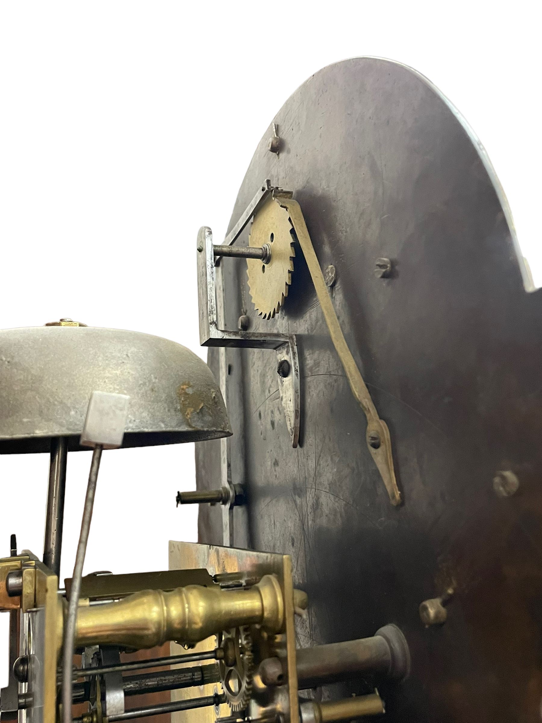 Henry Hindley of York – mid-18th century oak cased 8-day longcase clock,
flat topped caddy pediment with gesso finials, rectangular hood door flanked by wooden turned pilasters with capitals, canted trunk with a full-length break arch topped door on a short plinth with applied skirting and bracket feet, brass dial with a silvered chapter ring, Roman numerals and five-minute Arabic’s, minute and inner quarter hour tracks, matted dial centre with subsidiary seconds dial, blued steel hands and female head pattern spandrels, silvered calendar dial to the break arch with dolphin spandrels, four pillar rack striking movement, striking the hours on a bell. With weights and pendulum. 
H250 W48 D27
Henry Hindley originally from Wigan (Lancs) is recorded as working in York from Petergate 1731-41 then Stonegate 1741-1771. A famous and highly innovative maker, often referred to as the “Tompion of the North.” 
