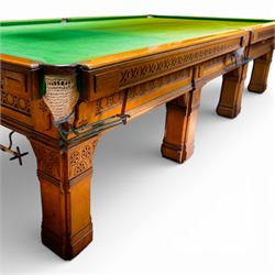 An outstanding bespoke late Victorian Aesthetic Movement golden oak full-sized snooker table of gothic influence, the rectangular slate bed covered in green baize within moulded rails and rounded pocket mounts, the protruding frame decorated with blind-fretwork frieze panels of Vitruvian scrolls and geometric ornament, over rails of repeating roundel carvings, raised on square chamfered and reeded supports with carved detail and panelled reserves, with further stylised brackets, stamped to the underside on all four edges R Anderson, serial number 4337
Viewing in situ near Tadcaster, please contact Chloe to arrange - 01904 393300