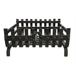 Ornate cast iron fire back with crown, and dog grate
