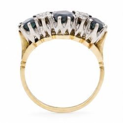 18ct gold sapphire and diamond ring, three graduating oval cut sapphires, the principal stone with two round brilliant cut diamonds set either side, London 1975, total sapphire weight approx 2.70 carat