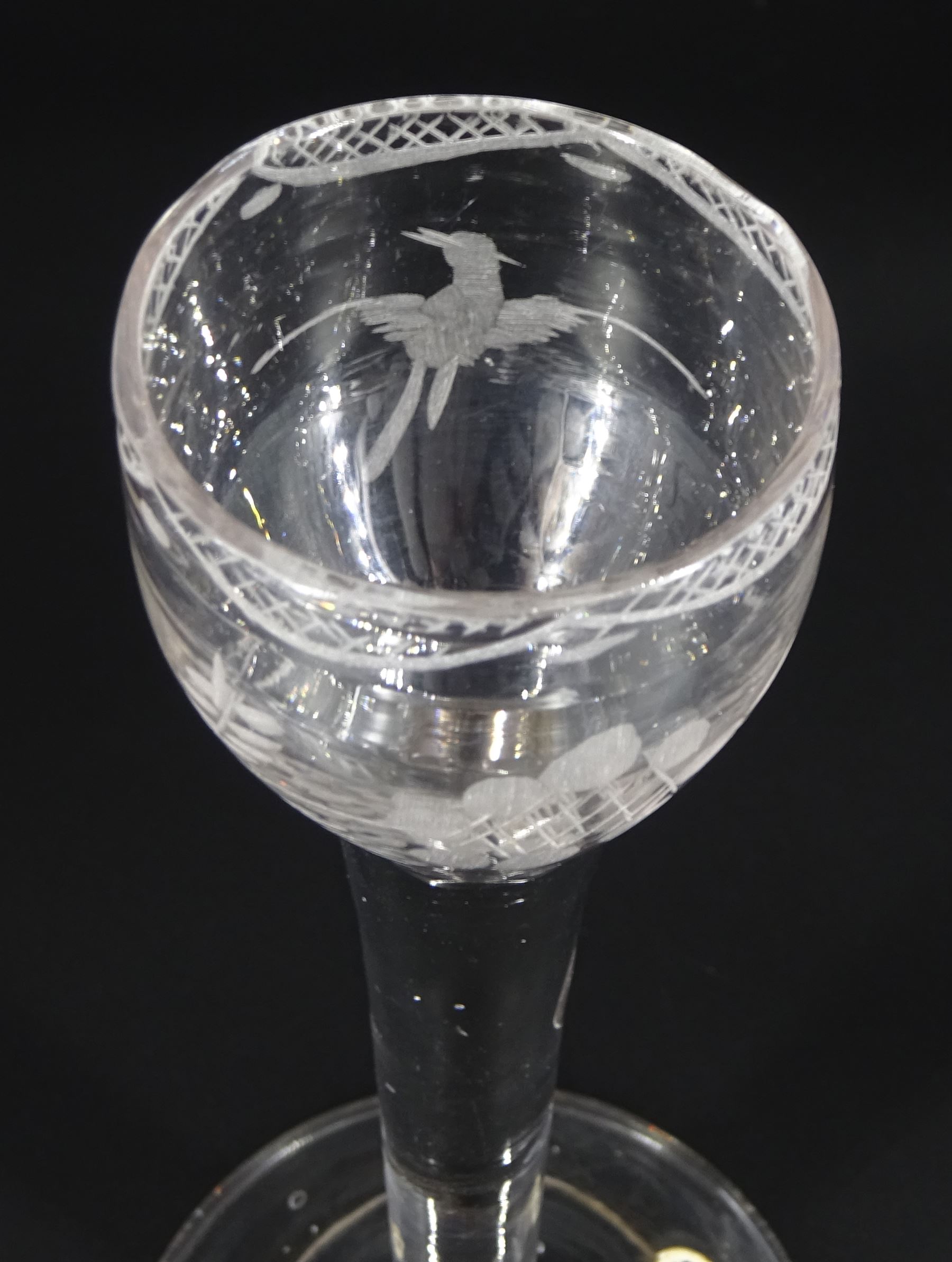 18th century cordial glass of possible Jacobite interest, the ogee bowl engraved with bird in flight and sunflower, upon a plain stem and folded conical foot, H15cm