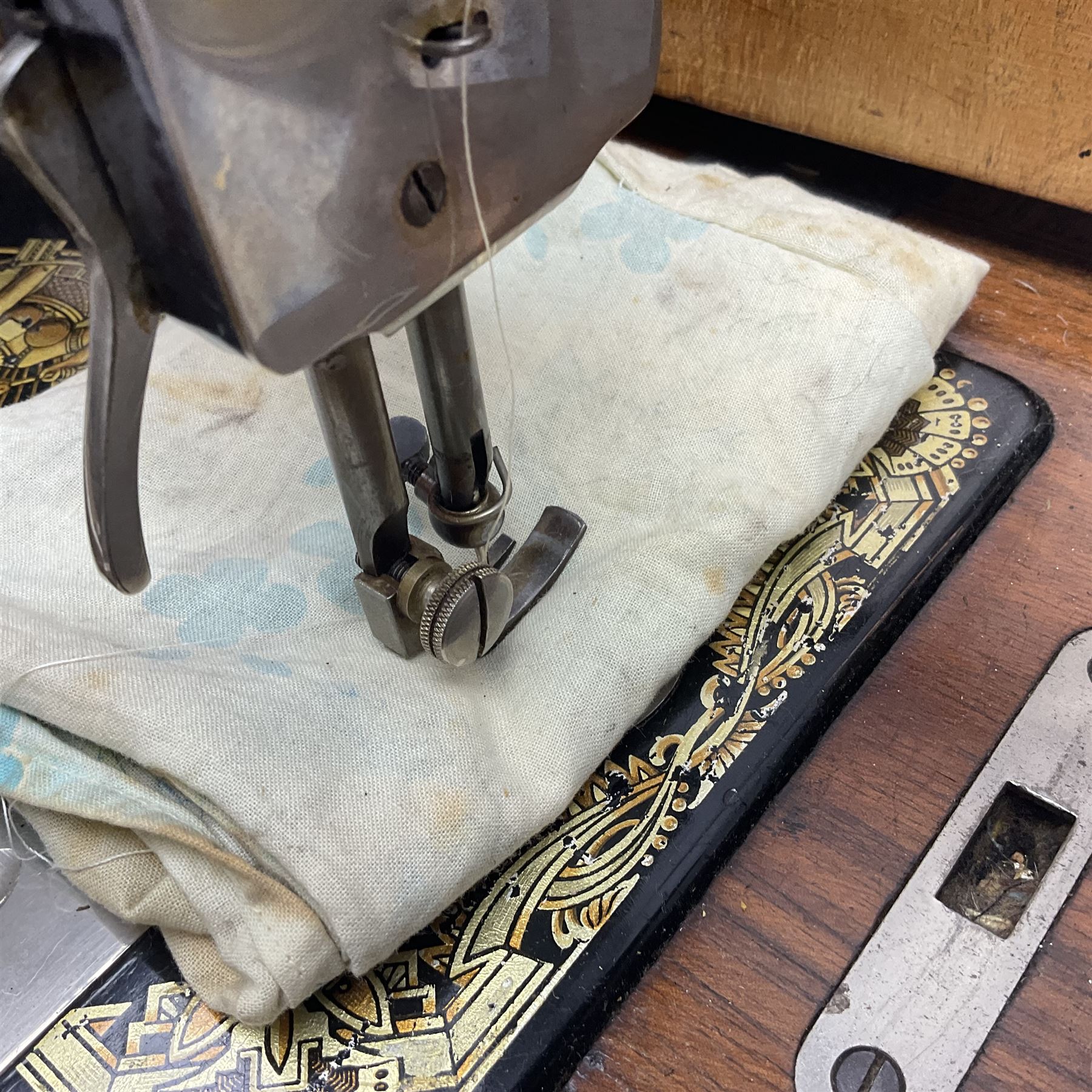 Cased sewing machine, together with bed warmer and copper hunting horn