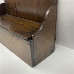 George III oak spoon rack and candle box, the rectangular backplate with shaped  pediment and two six aperture spoon racks, above a candlebox with hinged cover, with various brass spoons and a pair of brass candle snuffers, H56.5cm, W35cm, D14cm 