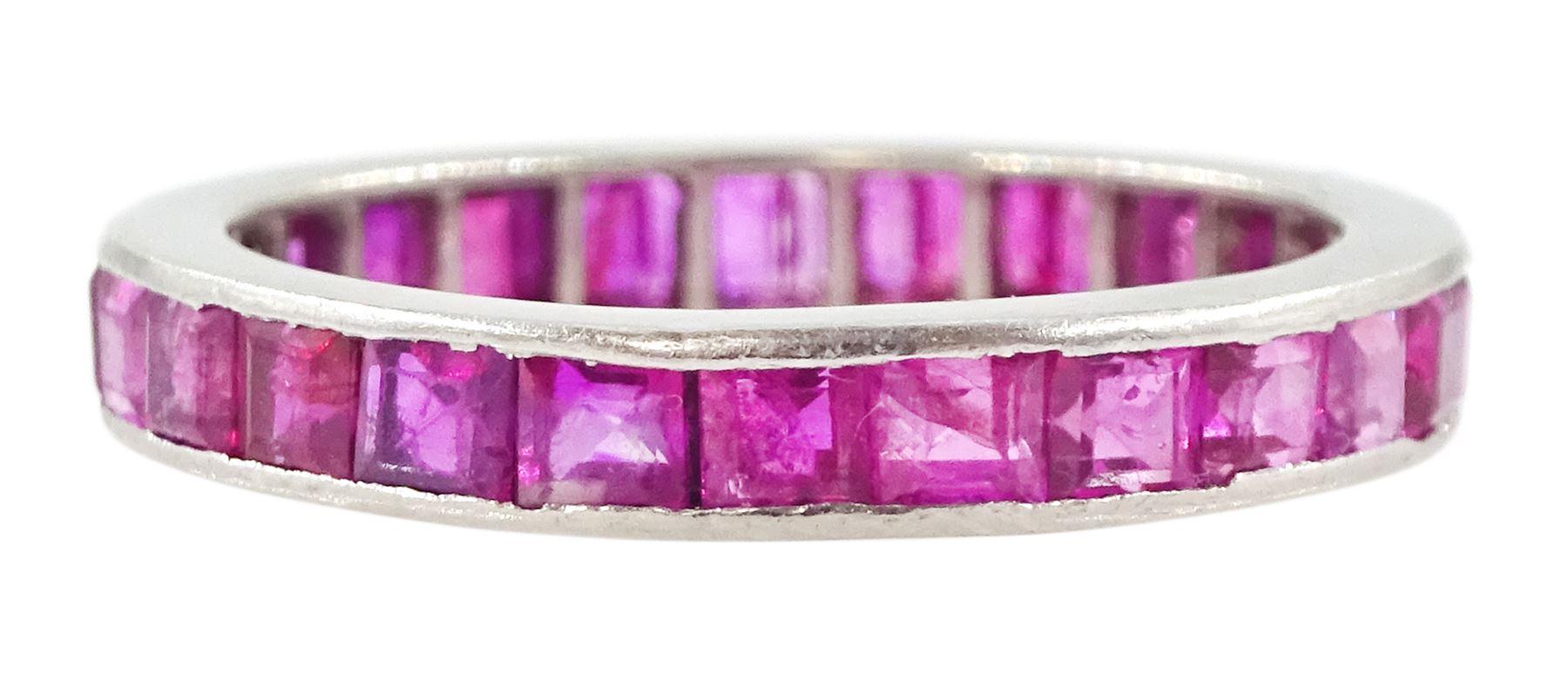 Platinum channel set, calibre cut ruby full eternity ring  