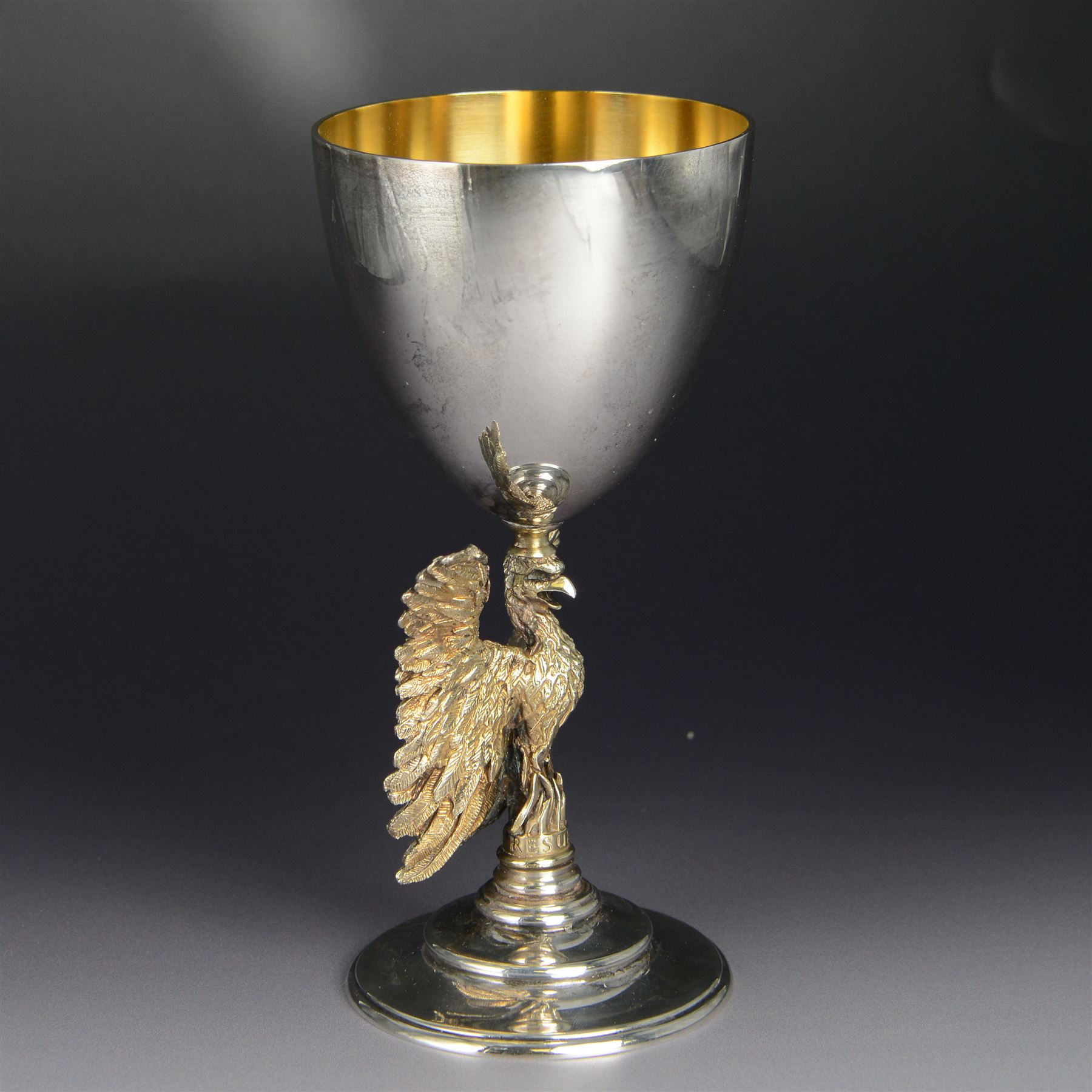 Modern limited edition silver goblet, 'made by order of the Dean and Chapter of St Paul's to commemorate the 300th anniversary of the laying of the foundation stone of the cathedral in 1675', designed by Jocelyn Burton for Aurum, the plain bowl with gilt interior, upon a parcel gilt stem in the form of a phoenix with wings outstretched,  limited edition no. 497, hallmarked Jocelyn Burton, London 1975, H16cm, boxed