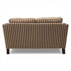 Late 20th century fabric upholstered sofa, with loose back and seat cushions, broad padded arms with piped borders, upholstered in striped textile, raised on concealed feet