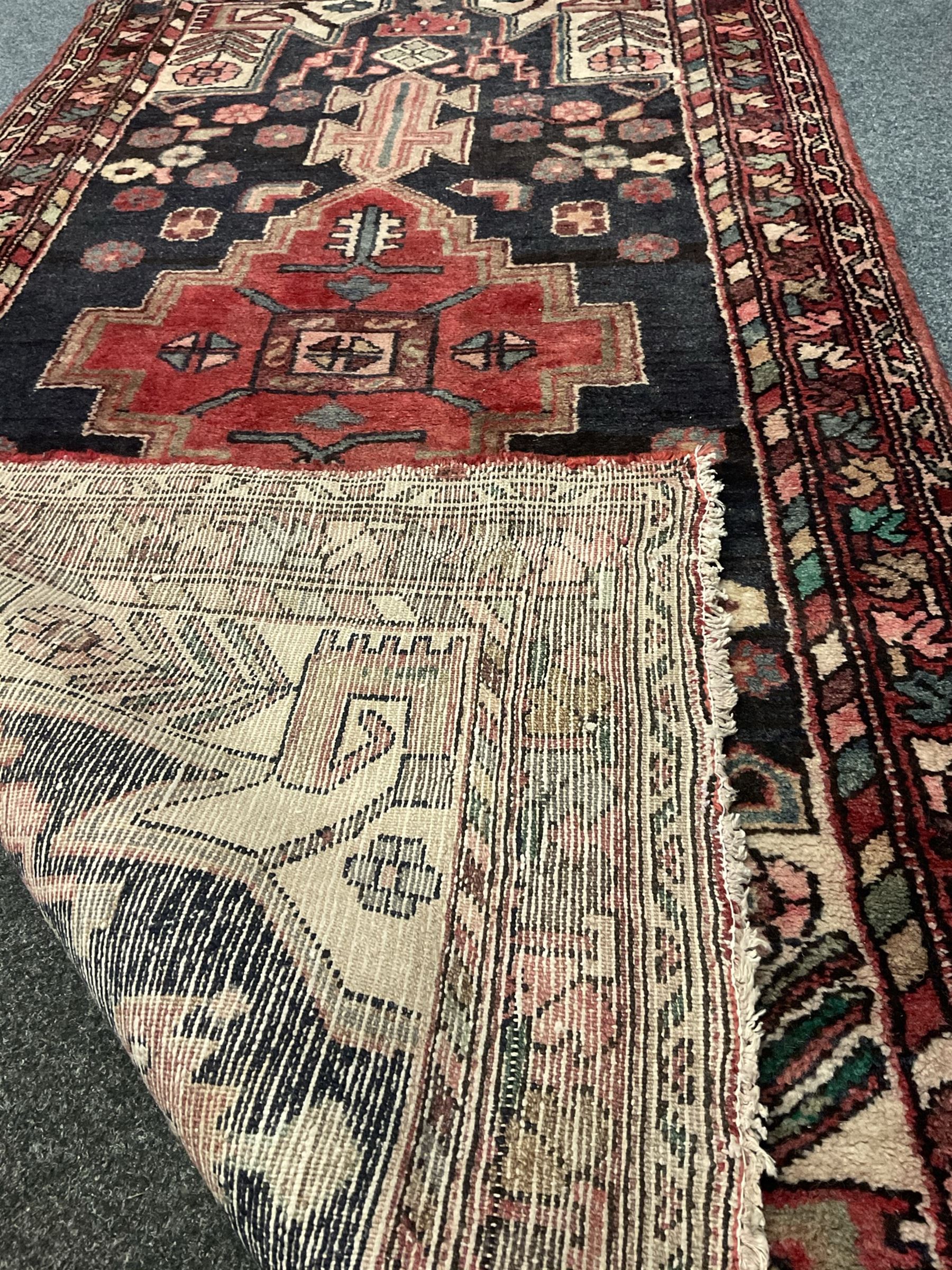 Persian red and blue rug, central medallion, geometric shape field