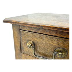 18th century oak lowboy, rectangular moulded top over three frieze drawers with brass swing handles, scalloped apron, on slender square section supports