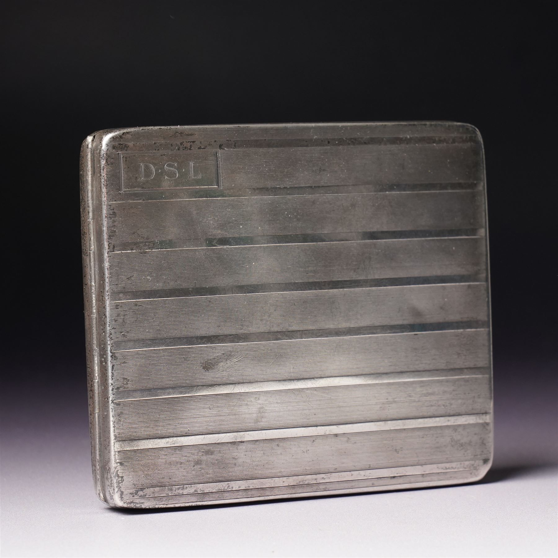 Engine turned silver cigarette case engraved with initials and with gilded interior Birmingham 1928