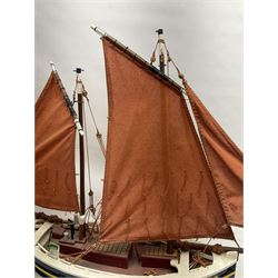 Wooden model of the Peterhead Herring Fishing Boat, Love Divine, PD404. on stand together with Wick Herring Fishing Boat, Galilee WK.1. on stand, L105cm, H64cm