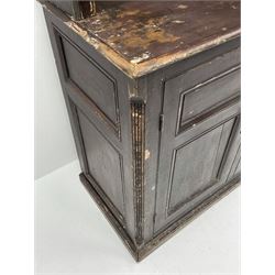 Early 19th century scumbled pine dresser, the projecting cornice over two heights plate rack with moulded frame, the base with reeded canted corners fitted with three drawers and two panelled cupboards, panelled sides, moulded skirt base