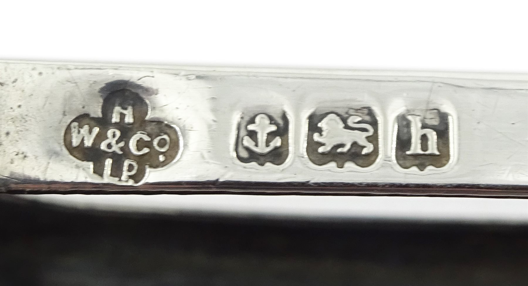 Silver oval shaped snuff box by Henry Williamson Ltd, Birmingham 1919, silver matchbox holder by Horace Woodward & Co Ltd, Birmingham 1907 and silver vesta case hallmarked, approx 4.4oz 