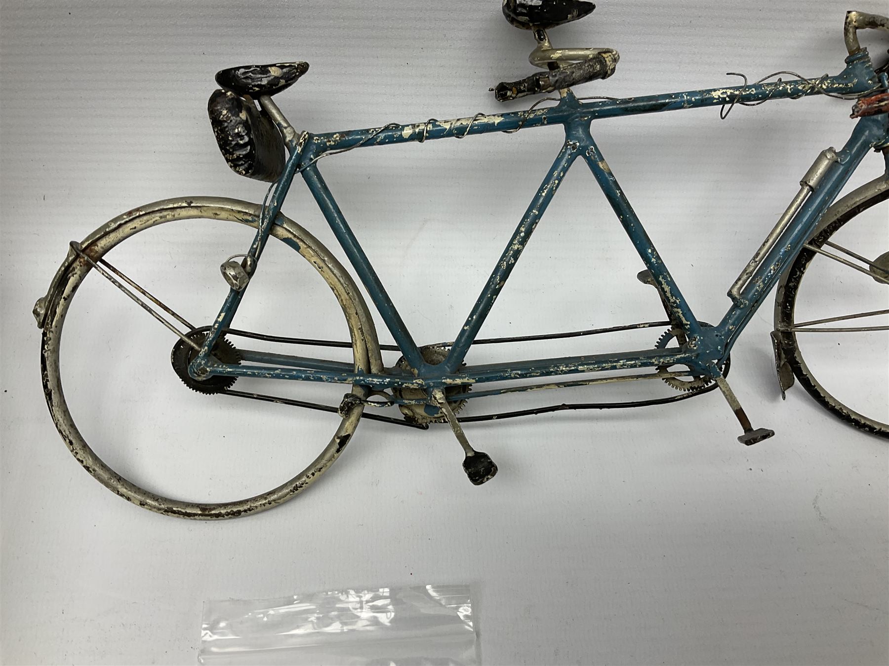 Chad Valley clockwork Fordson Major Tractor, a group of play worn Britains and other lead and metal farm animals, figures and accessories including a kennel, haystacks, dovecote, cows, sheep etc, together with a diecast model of a Tandem Bike L31cm