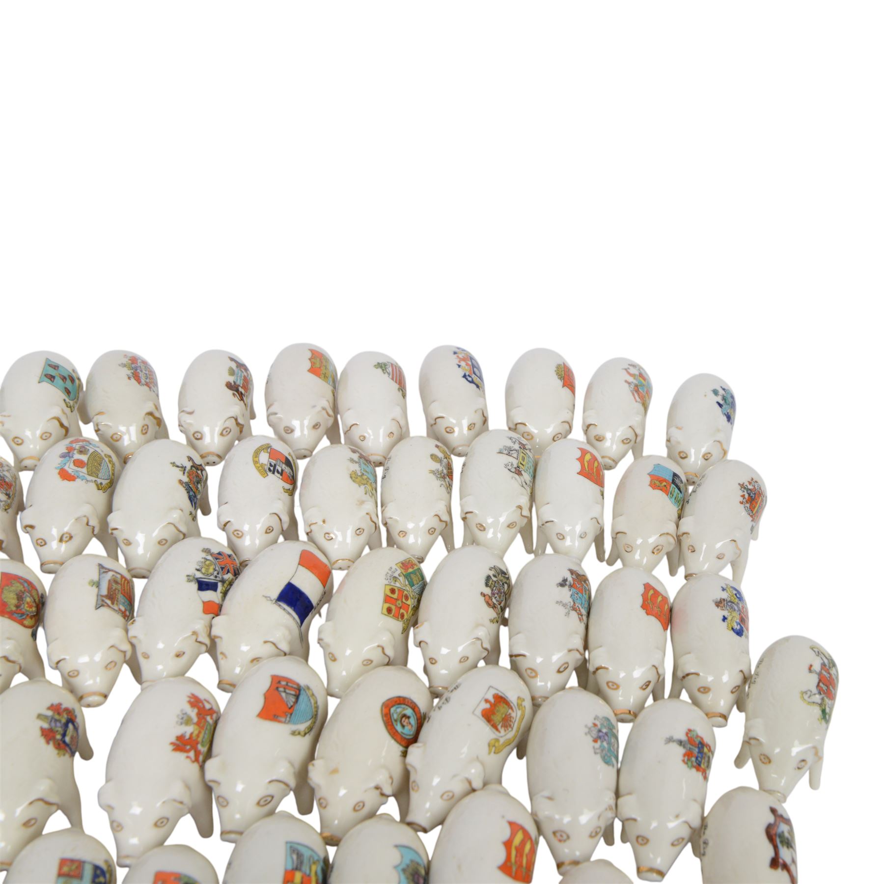 Large collection of Crested Ware pigs, including examples from Southport, Layton, Tottenham Whitby etc 