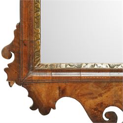 18th century Chippendale design walnut wall mirror, shaped and scroll carved cresting with central gilt acanthus roundel, moulded frame with inner gilt slip, shaped apron and scroll carved corners