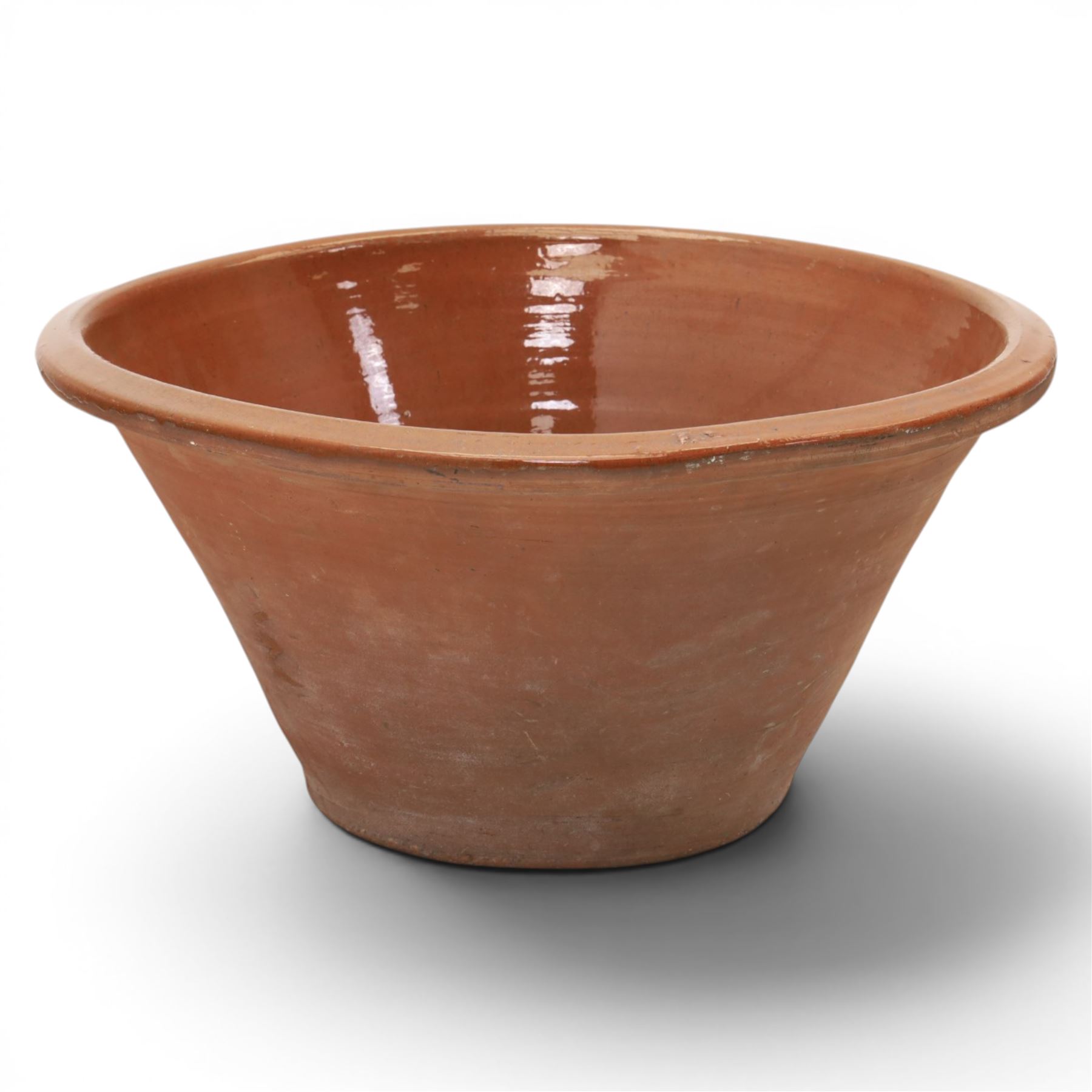Very large 19th century terracotta pancheon, of typical tapering circular form, with brown slip glazed interior, H30cm D62cm