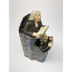 A 19th century Staffordshire figure group, modelled as a sleeping judge and clerk, H24cm. 