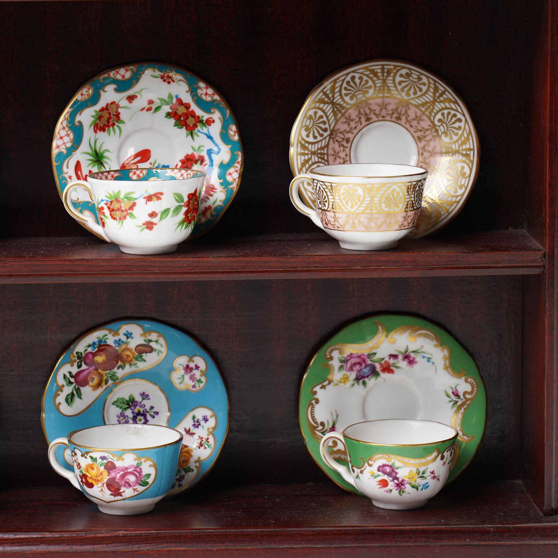 Royal Worcester miniature cups & saucers collection, 1993,  various patterns on display shelf, with certificates, shelf H49cm