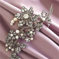 19th century gold and silver diamond and pearl en tremblant detachable brooch, the flower tremblant with a principal old cut diamond of approx 1.90 carat, the petals and stamen set with old cut and rose cut diamonds, total diamond weight approx 9.10 carat, to a foliate spray set set with further rose cut diamond and white / pink / cream pearls and ribbon tie