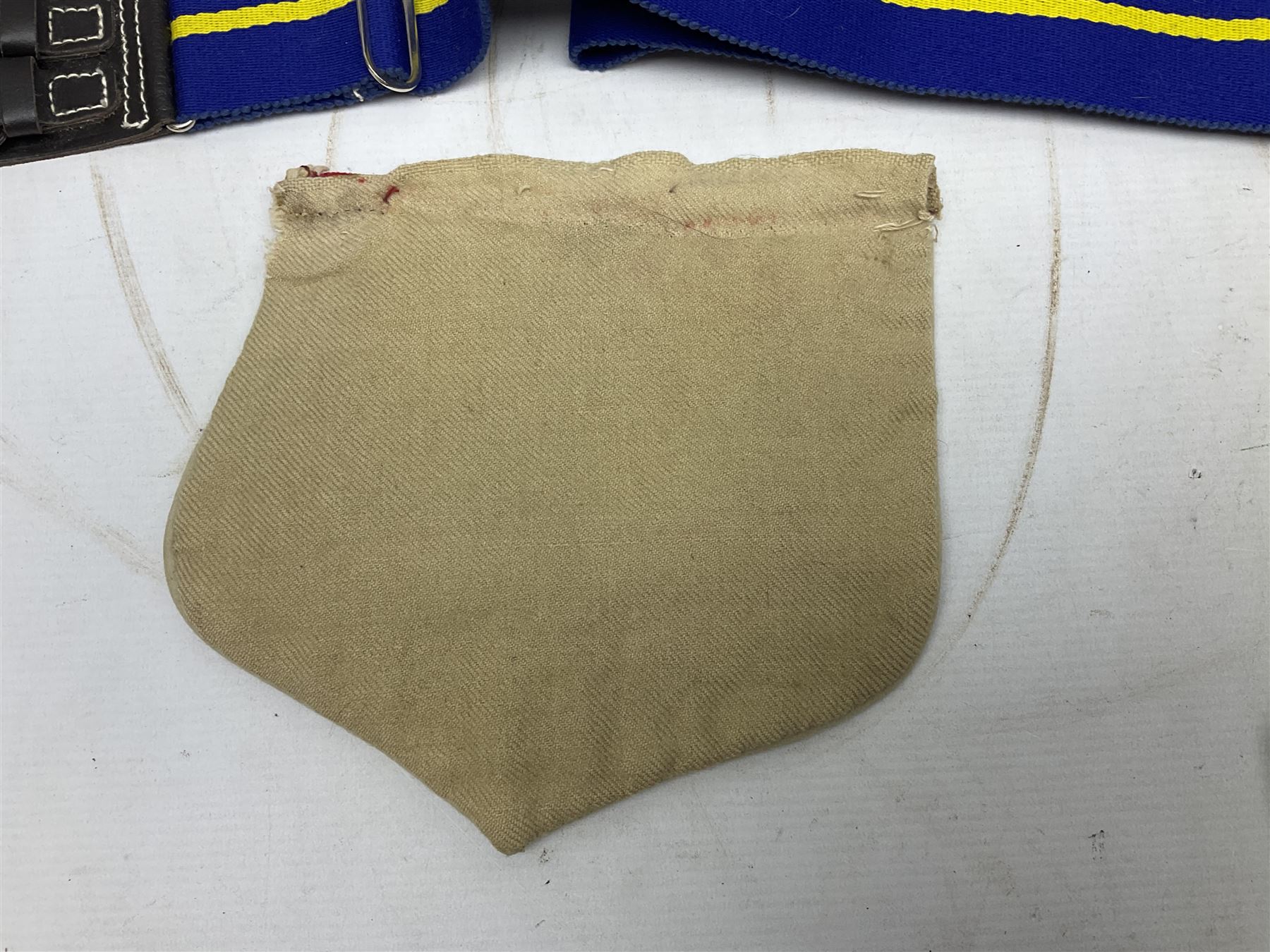 Miscellaneous militaria including two Royal Artillery and one Royal Horse Artillery stable belts; Northamptonshire Regiment trench art brass shell case lighter; unused Matchless Fire-Set; pocket knives and multi-tool; lanyards; oak shield with York & Lancaster crest etc