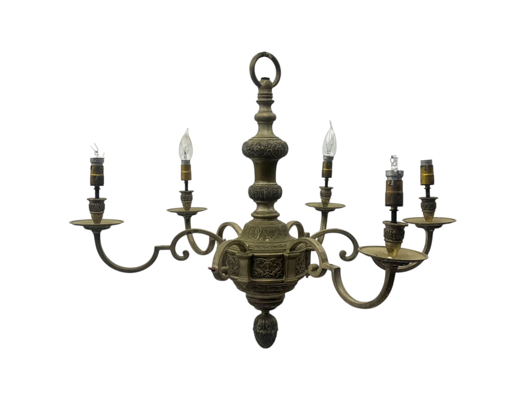 Pair of mid-20th century brass chandeliers, each with cast foliate and scroll decorated central body, issuing six scrolling arms with circular drip pans and bulb holders, suspended from integral ceiling loops