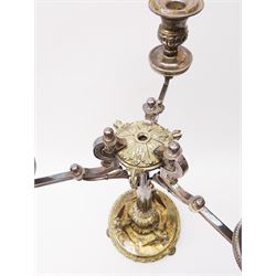 A large Victorian Thomas Bradbury & Sons silver plated candelabrum, the circular base with flower head border upon three domed feet, supporting a central knopped and fluted column flanked by three zoomorphic creatures, leading to a central socket with removable nozzle above a large palmette detailed drip pan, and three scrolling branches with conforming sockets and nozzles, with maker's silver plate mark and Victorian registration lozenge beneath, H62.5cm