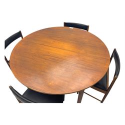 Mid-20th century teak extending dining table, circular top with pull-out extension and concealed leaf extension mechanism, on tapered supports; set of four teak dining chairs with black vinyl padded seats 
