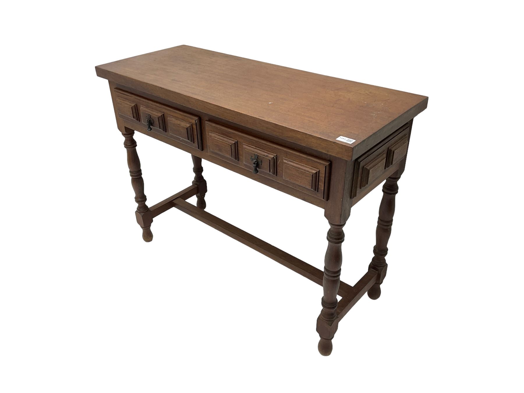 Spanish oak side table, fitted with two drawers with moulded facias, raised on turned supports united by stretcher