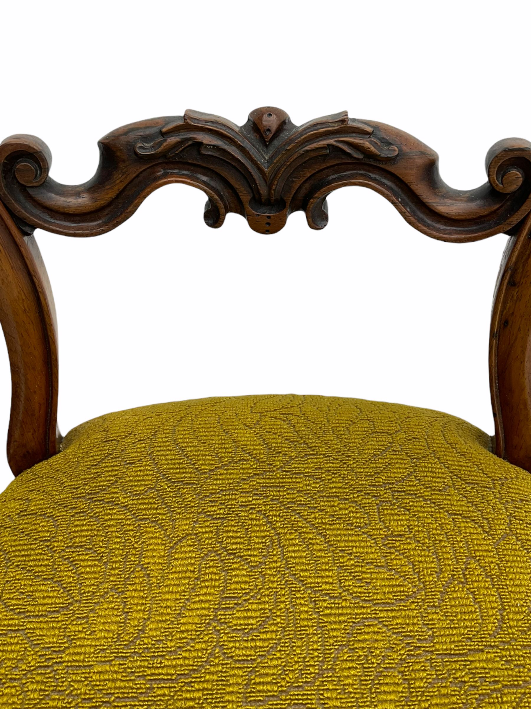 Set of four Victorian rosewood chairs, serpentine seats with horsehair