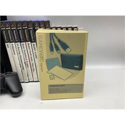 Sony PlayStation 3 60GB console with one PS3 controller, two PS2 controllers, BD remote control, PSP handheld gaming console with case, GAMEware PSP essentials pack, and a selection of PS2, PS3 and PSP games in original cases with instruction booklets 