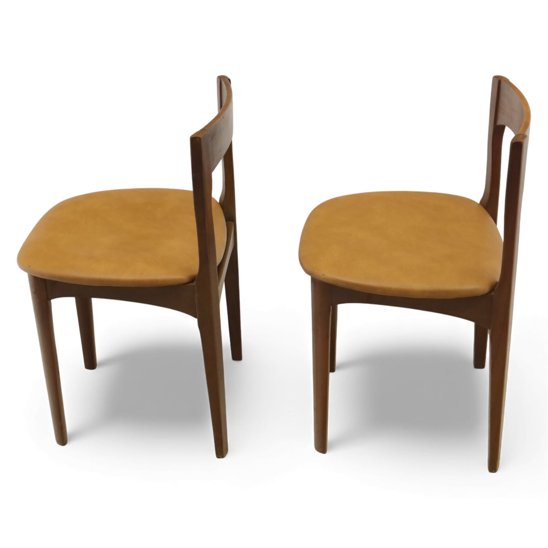Mid 20th century living room furniture, comprising of a pair of Nathan teak dining chairs, each with curved open backrests and shaped seats, together with a Danish teak coffee table, rectangular top inset with decorative ceramic tiles, on square tapered supports
Chairs (H 73cm, W 48cm)
Table (H 41cm, W 81cm, D 47cm)