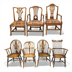 George III oak drop-leaf oval dining table with harlequin set of seven 18th century and later chairs including a comb-back Windsor, the table with turned gatelegs united by box stretcher, shaped apron extending to 212cm, the chairs of various forms, three Windsor carvers, a comb-back Windsor, plus a set of three Georgian mahogany dining chairs, pierced splat backs, with matching drop-in upholstered seats