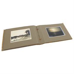 Early 20th century photograph album, documenting the travels of RMS Alcantara, with painting to front cover and containing black and white photographs
