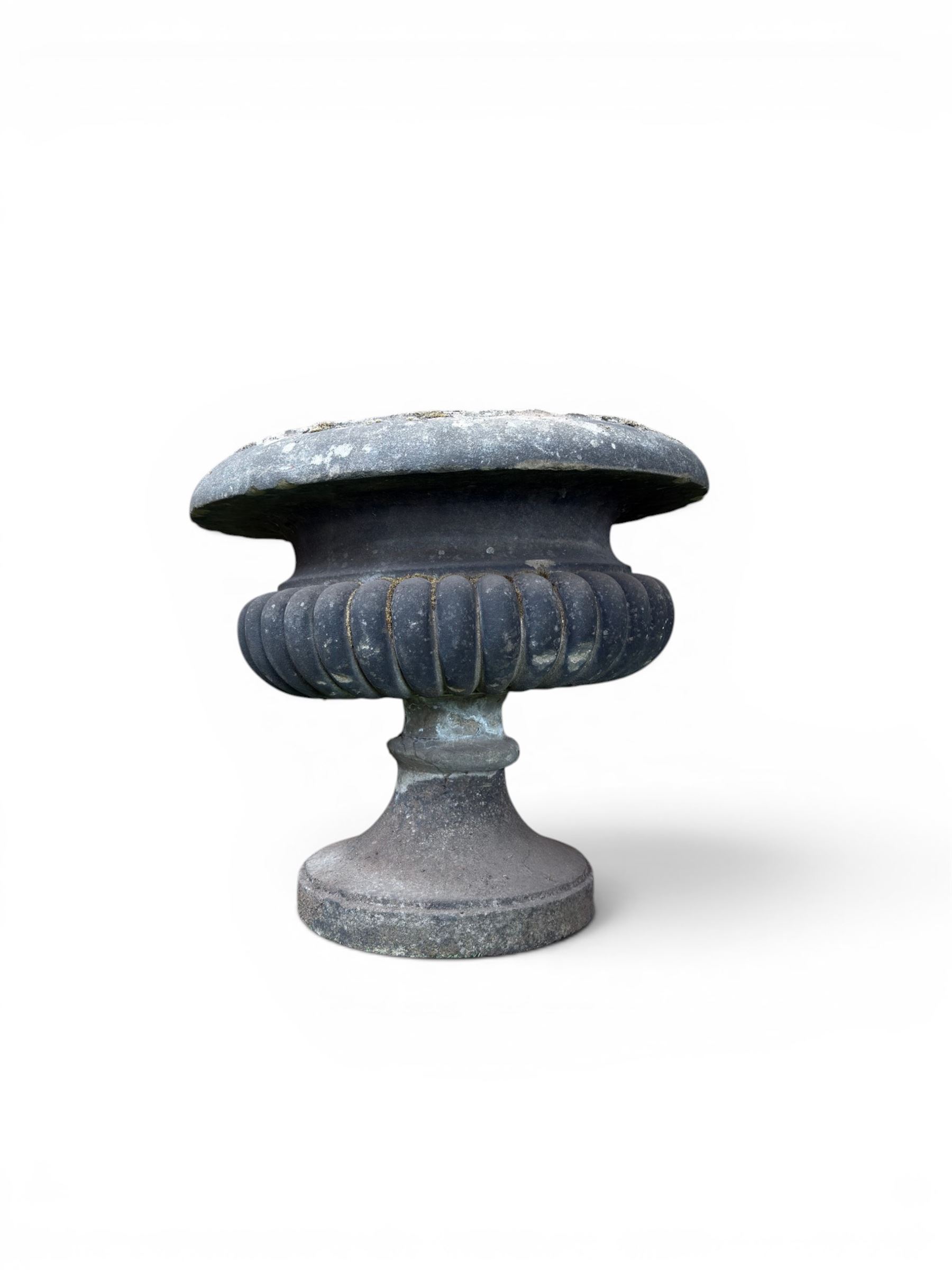 Carved sandstone garden urn, gadrooned campana form